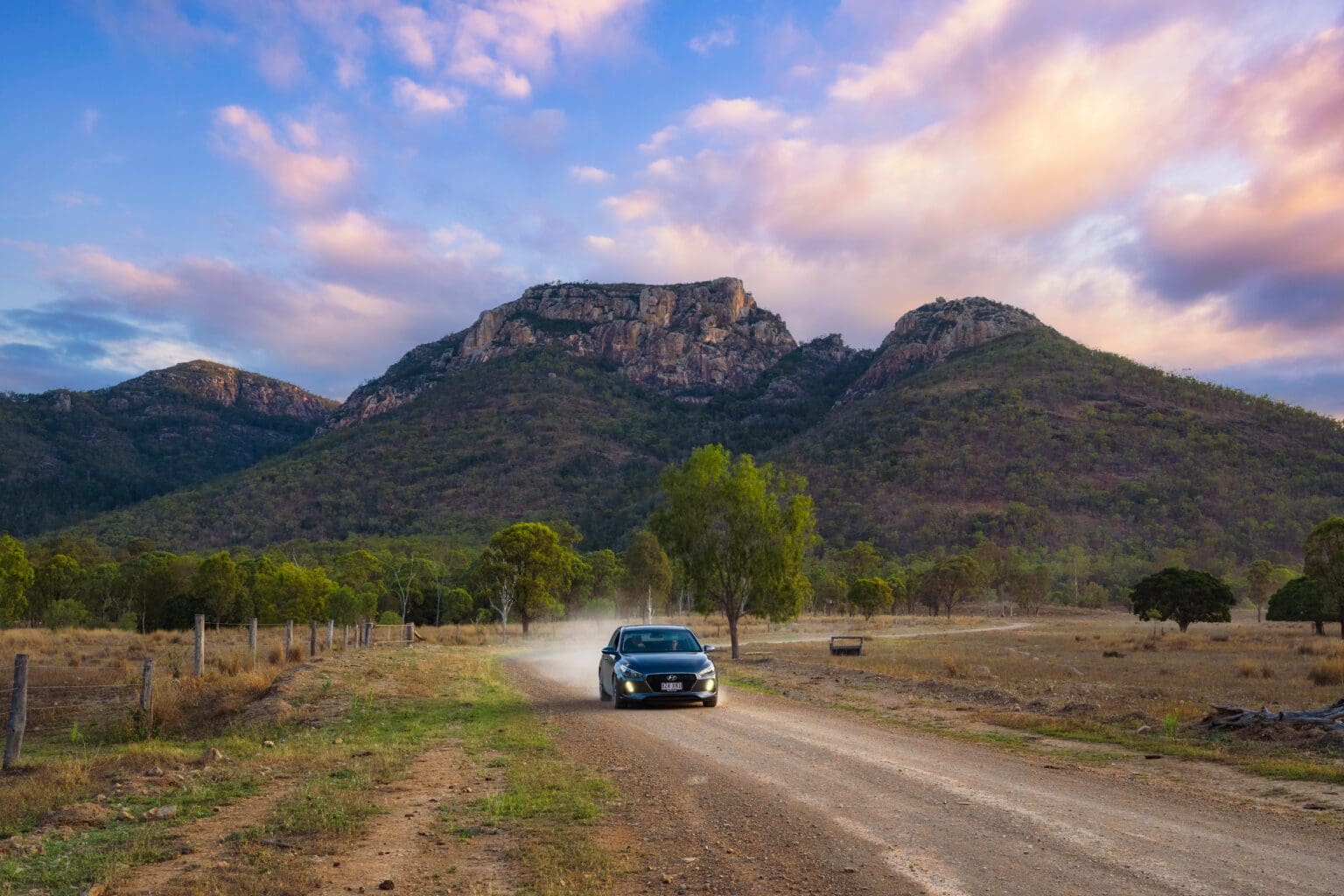 Car driving away from Mount Walsh in the North Burnett