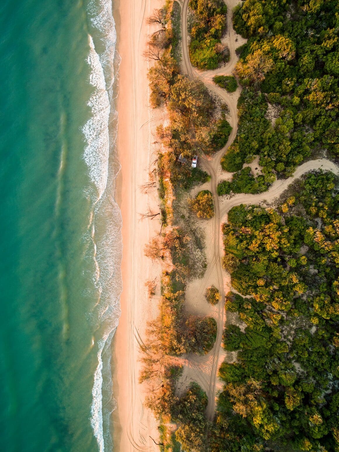 Drone image of 4WD on dunes beside the ocean in the Burrum Coast National Park - Kinkuna Section